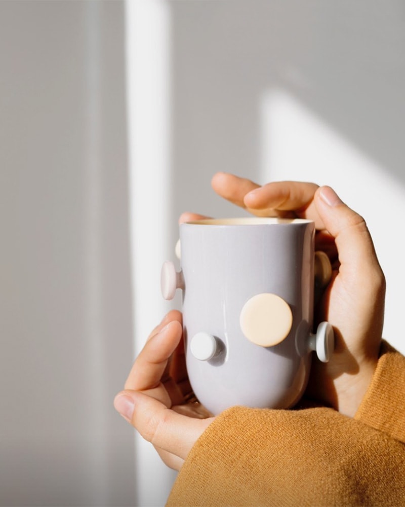 cup with button handles