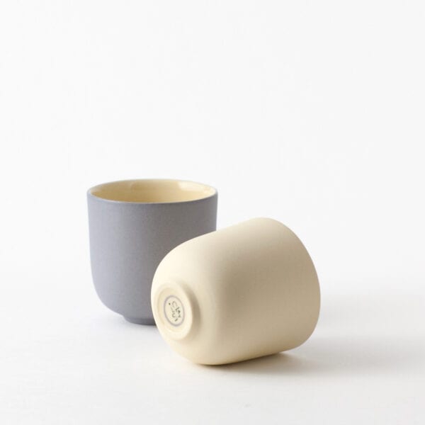 espresso-pair-blueberry-yellow-side two minimal espresso cups, one lies on a side