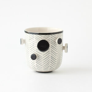 black and white cup with knobs