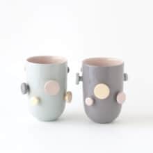 colorful mugs with round knobs