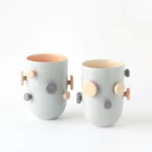 buttons_tall_pair_blue_yellow-apricot Two tall cups with buttons