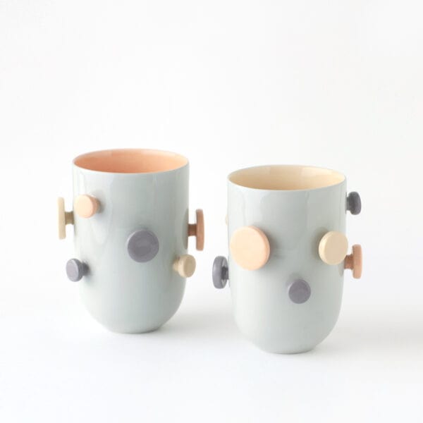 buttons_tall_pair_blue_yellow-apricot Two tall cups with buttons