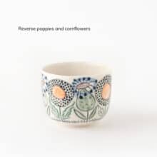 Swedish-Summer-color-reverse-poppy-corn cup with poppies and cornflowers