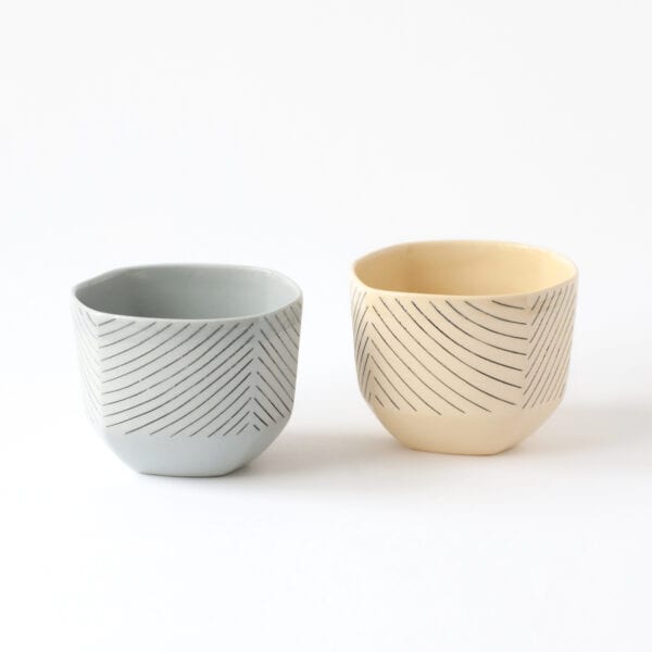 a pair of hexagonal cups